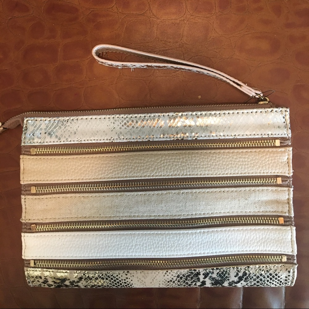 Mixed texture ‘zipper’ wristlet clutch by Sondra Roberts.
